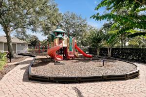 a playground with a slide in a park at Entire home w/ Private Pool,Gated Near Disney in Orlando