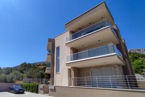 a building with a car parked in front of it at Zavala Residence in Zavala
