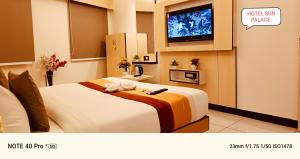 Voodi või voodid majutusasutuse Hotel Sun Palace toas