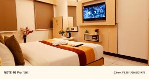 Voodi või voodid majutusasutuse Hotel Sun Palace toas