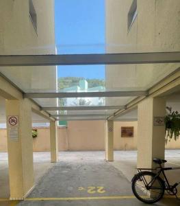 a bike parked in an empty parking garage at Recanto das Ondas in Ubatuba