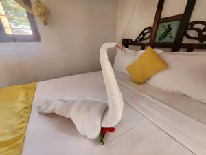 Postel nebo postele na pokoji v ubytování Seagull Nungwi Resort