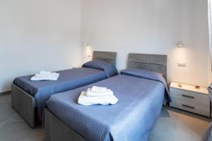 En eller flere senge i et værelse på Casa Di Gregorio - Intero Appartamento