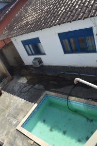 Πισίνα στο ή κοντά στο Kitnet em Jacarepaguá ROCK IN RIO