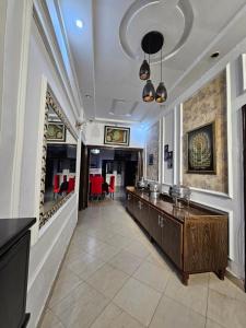 a large hallway with a bar in a building at Hotel Tulip Inn, Gulberg in Lahore
