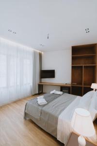 Postel nebo postele na pokoji v ubytování Dyrmo Hotel