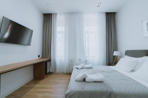 Postel nebo postele na pokoji v ubytování Dyrmo Hotel