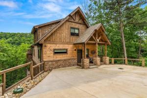 a wooden cabin with a porch and a fence at Excellent View Arcade Pool Theater Spa Resort Fun in Park Settlement