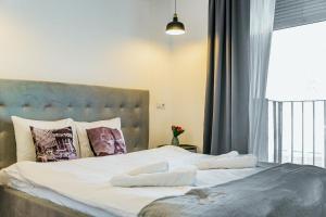 Ένα ή περισσότερα κρεβάτια σε δωμάτιο στο Hacienda Coltea - Cozy Old Town Apartaments