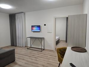 Televiisor ja/või meelelahutuskeskus majutusasutuses Albergo Al Gambero