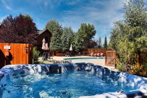 a large plunge pool in a backyard with a fence at Modern 3bd cabin in Edgewater in Granby