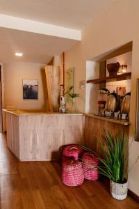 a kitchen with baskets on the floor and a counter at Fortmar Hotel in Fortaleza