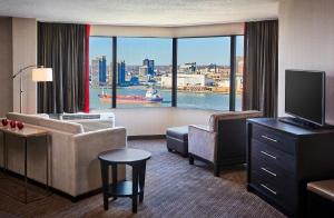 a hotel room with a view of a city at Best Western Plus Waterfront Hotel in Windsor