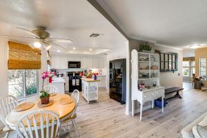 a kitchen and dining room with a table and chairs at Pet-Friendly Riverside Retreat with Private Spa! in Riverside