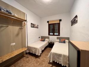 Ένα ή περισσότερα κρεβάτια σε δωμάτιο στο Kalma experiencias turísticas