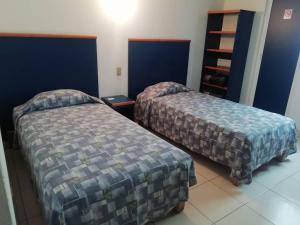 Postel nebo postele na pokoji v ubytování Hotel Vagabundo Expo Guadalajara