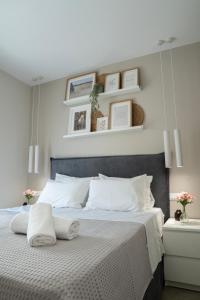 a bedroom with a large bed with two white pillows at Armonía Luxury Apartments in Ierápetra