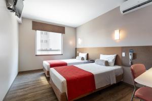 Postel nebo postele na pokoji v ubytování Go Inn Hotel Curitiba