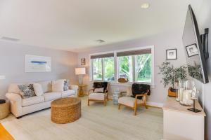 a living room with a couch and chairs at Coastal-Modern Home Less Than 3 Mi to Charlestown Beach! in South Kingstown