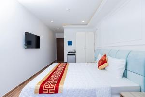 TV a/nebo společenská místnost v ubytování Phú Gia Hotel 99 Đường D1, KDC Him Lam, Tân Hưng, Quận7