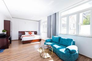 Postel nebo postele na pokoji v ubytování Phú Gia Hotel 99 Đường D1, KDC Him Lam, Tân Hưng, Quận7