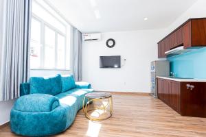 TV a/nebo společenská místnost v ubytování Phú Gia Hotel 99 Đường D1, KDC Him Lam, Tân Hưng, Quận7
