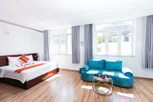 Postel nebo postele na pokoji v ubytování Phú Gia Hotel 99 Đường D1, KDC Him Lam, Tân Hưng, Quận7