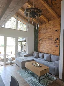 a living room with a couch and a table at Bear Secret House in Ćuprija