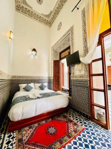 Postel nebo postele na pokoji v ubytování Riad Zawiyat Fes