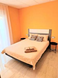 Postelja oz. postelje v sobi nastanitve Apartament Sant Jaume D'enveja