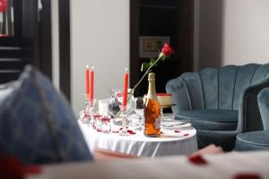 a table with a bottle of champagne and glasses at Golden Bujari Bisha in Qal'at Bishah