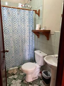 Vannituba majutusasutuses Hostal Cattleya