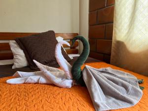 Voodi või voodid majutusasutuse Hostal Cattleya toas