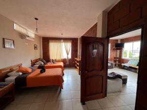 Voodi või voodid majutusasutuse Hostal Cattleya toas