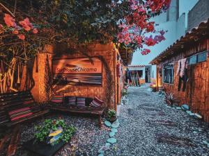 a street with benches and a sign on a building at Surf House Chicama in Puerto Chicama