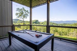 a pool table on a deck with a view at High Meadow Retreat in Boone