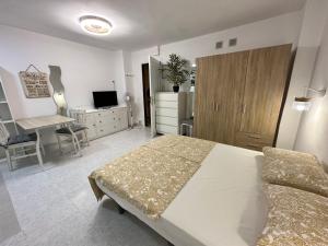 Ένα ή περισσότερα κρεβάτια σε δωμάτιο στο Travelingdays Gloria