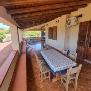 a dining room with a table and chairs in a house at La Villa di Nino in Ustica