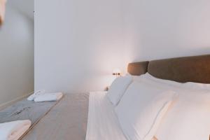 Postel nebo postele na pokoji v ubytování Dyrmo Hotel