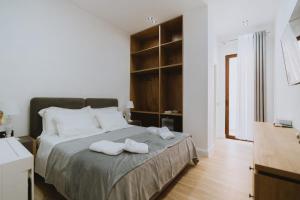 Postel nebo postele na pokoji v ubytování Dyrmo Hotel