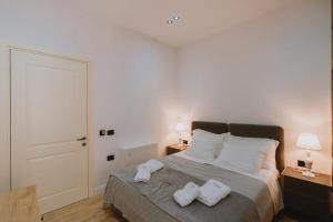 Postel nebo postele na pokoji v ubytování Dyrmo Hotel