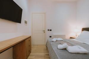 Postel nebo postele na pokoji v ubytování Dyrmo Hotel