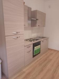 a kitchen with a stove and a sink at Casa Iris in La Spezia +11 photos