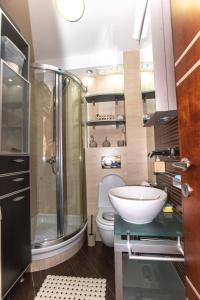 a bathroom with a shower and a toilet and a sink at Vukotic in Budva