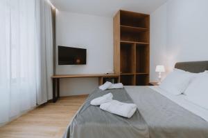 Postel nebo postele na pokoji v ubytování Dyrmo Hotel