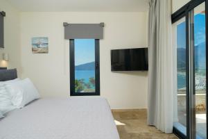 Postel nebo postele na pokoji v ubytování Mon Avis Suites