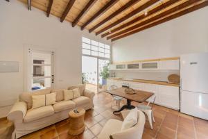 a living room with a couch and a table at Luxury House Grand Central in Arrecife