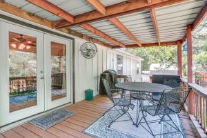 a patio with a table and chairs on a deck at Upscale Lake Texoma Vacation Home 1 Mi to Marina! in Willow Spring +22 photos