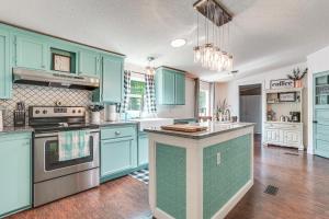 a kitchen with blue cabinets and a counter top at Upscale Lake Texoma Vacation Home 1 Mi to Marina! in Willow Spring