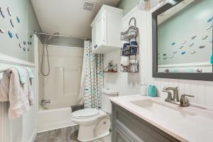 a bathroom with a sink and a toilet and a tub at Upscale Lake Texoma Vacation Home 1 Mi to Marina! in Willow Spring